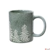Kép 1/2 - Bögre porcelán karácsony 24' fenyőfás 8cmx12cmx9.5cm sdkae