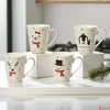 Kép 2/2 - Bögre porcelán karácsonyi 24' 4féle mintával 5,5cmx8.5cmx10.5cm sdkae 1db/á