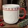 Kép 5/6 - Bögre porcelán karácsonyi fehér színű piros füllel   SDKAE25 dombornyomott 2 féle 8,7x9,3cm