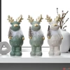 Kép 2/2 - Karácsonyi dekor szarvas 24' 3 féle kerámia figura 9.5cmx8.7cmx22cm sdkae